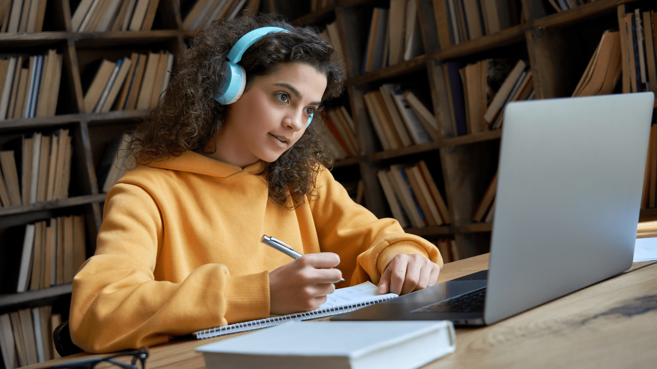 A medical student studying for the USMLE in a library using Brosencephalon.